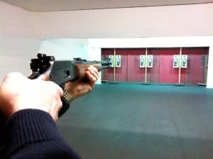 Taking aim with a lever action rifle at a target at NE Lincs Target Club